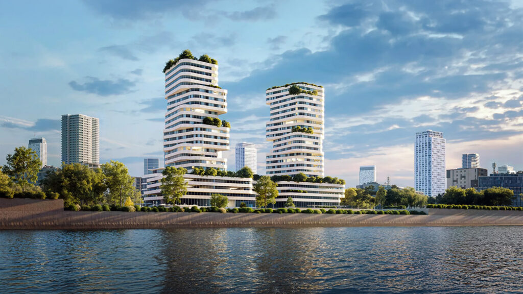 Architectonische visualisatie van twee moderne hoogbouw woontorens met gebogen, gelaagde gevels en weelderig groen op meerdere terrassen, gelegen aan een waterkant met op de achtergrond de skyline van de stad onder een gedeeltelijk bewolkte hemel.