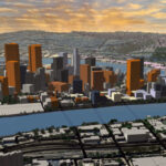 A 3D aerial perspective of a sprawling and detailed city model, generated with the PlaceMaker 4 plugin. The image displays clean white massing models of buildings, detailed road networks, trees, and a waterway, perfectly illustrating how designers can rapidly create complete 3D contexts.