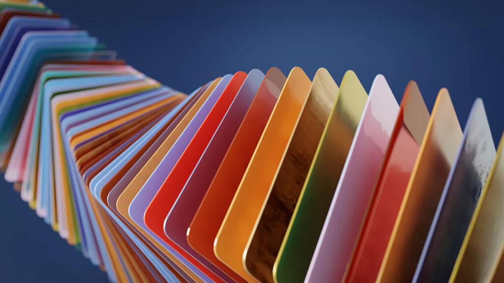 A photorealistic 3D render of a spiraling series of colorful, rectangular material swatches against a dark blue background. This hero image demonstrates the stunning render quality, high-end reflections, and versatile material options of the V-Ray 7 render engine for Blender.
