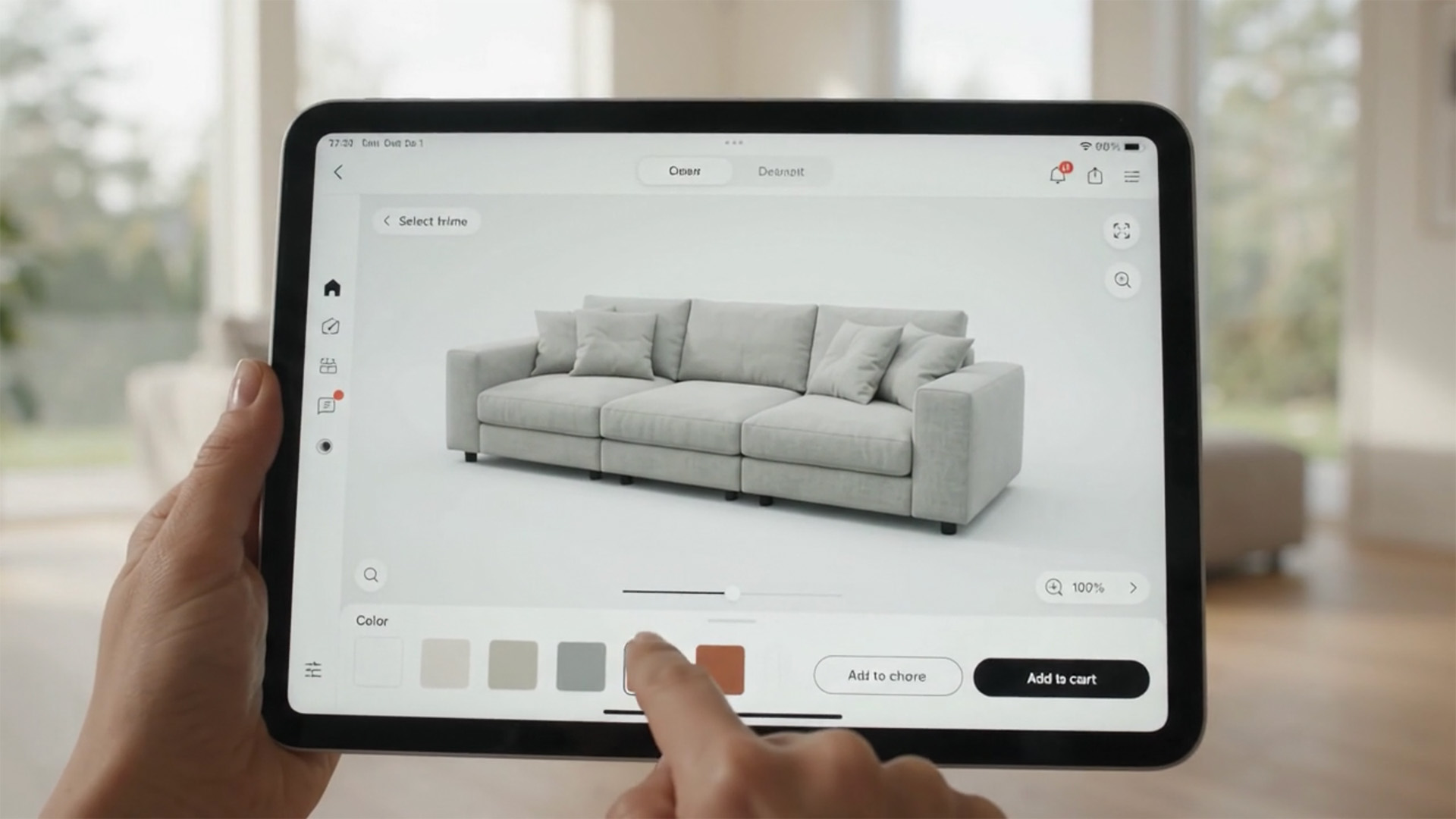 A person holds a tablet displaying an interactive 3D product configurator. The screen shows a detailed 3D model of a modular grey sofa, with the user selecting a new color from a digital color palette using their finger.